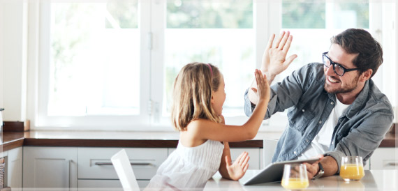 little girl and Dad high fiving